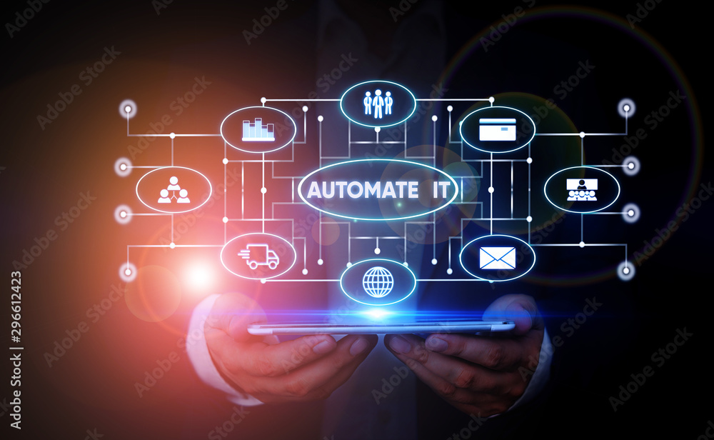 Writing note showing Automate It. Business concept for convert process or facility to be operated automatic equipment. Male wear formal suit presenting presentation smart device